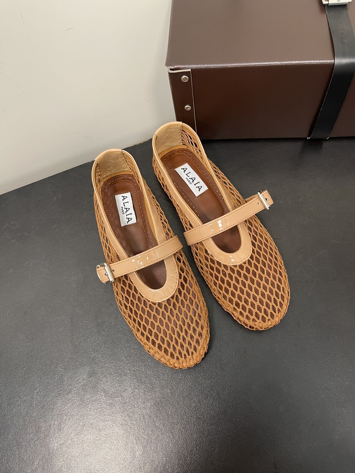 ALAIA BALLET FLATS IN COPPER BROWN MESH FISHNET