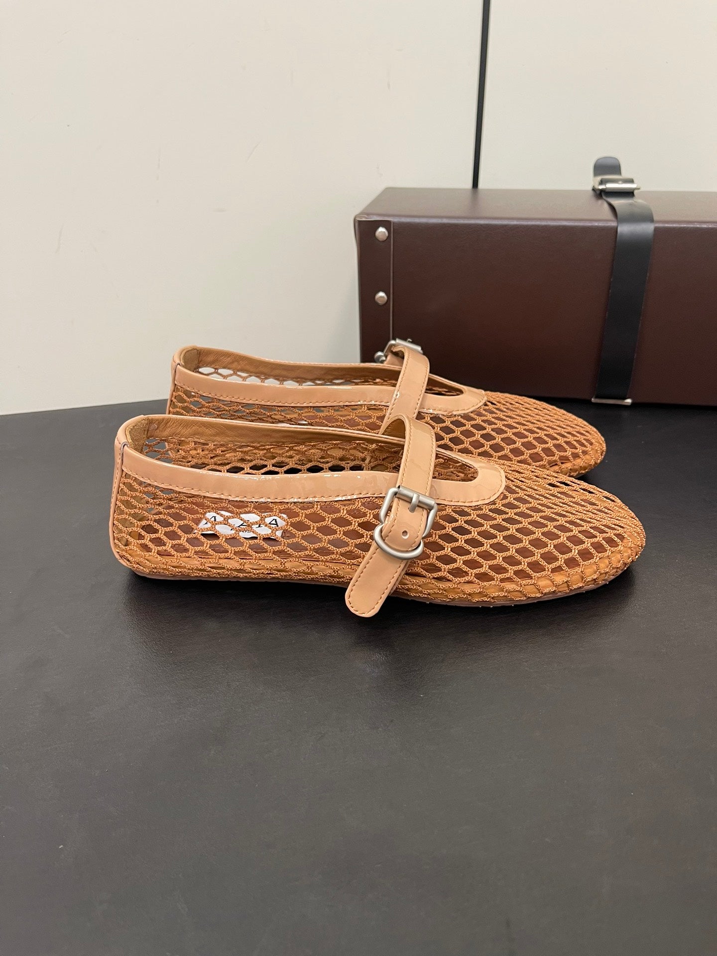 ALAIA BALLET FLATS IN COPPER BROWN MESH FISHNET