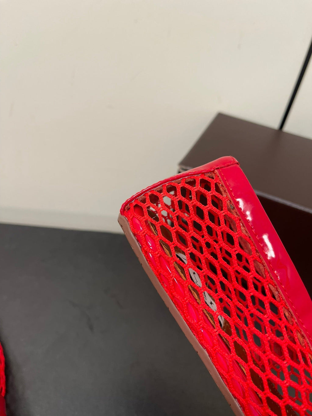 ALAIA BALLET FLATS IN CHERRY RED MESH FISHNET