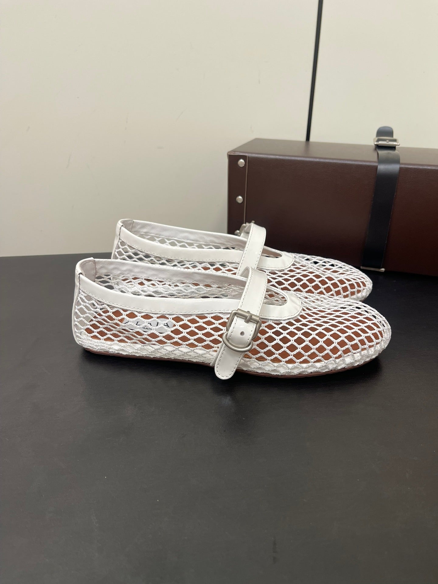 ALAIA BALLET FLATS IN WHITE MESH FISHNET