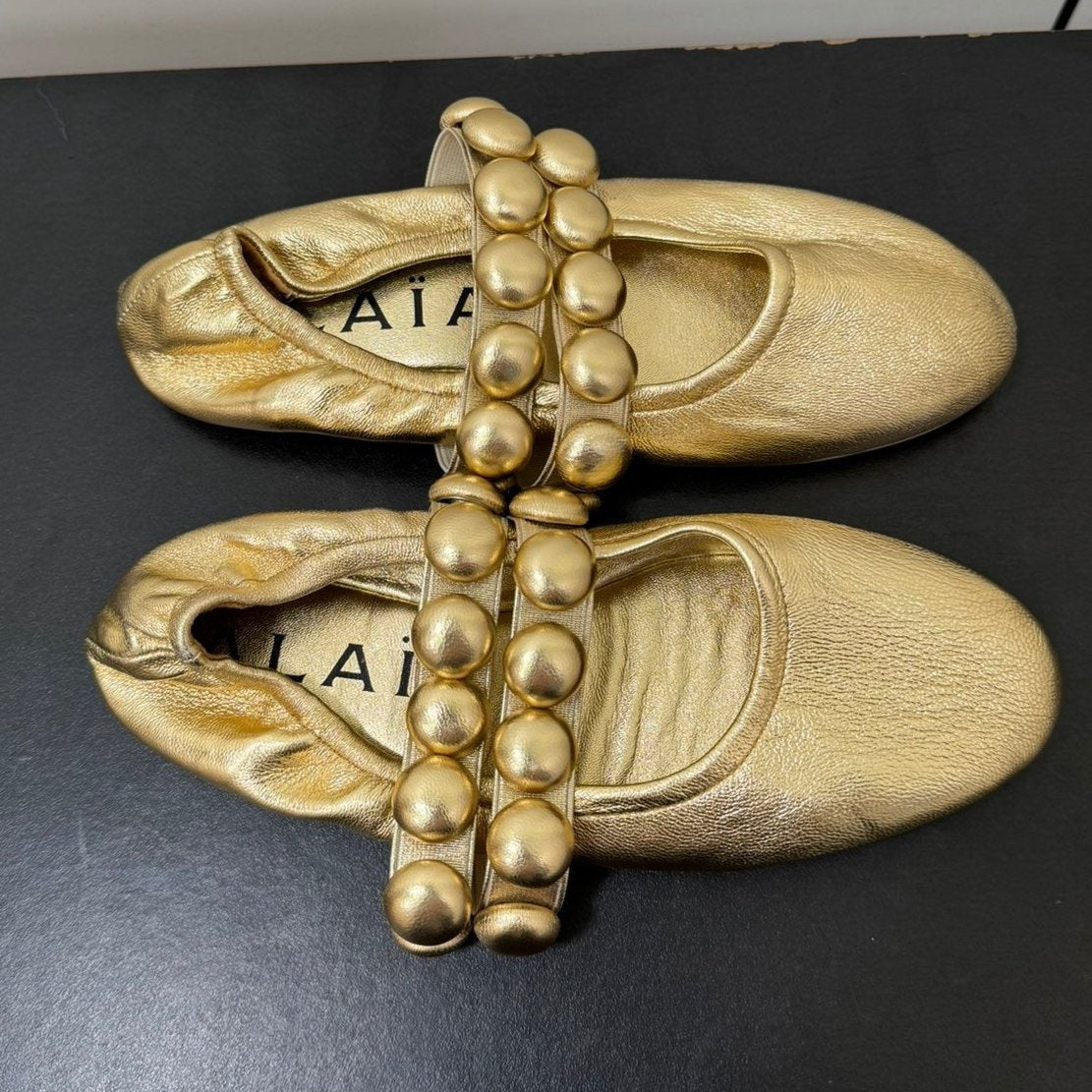 ALAIA SPHERE BALLET FLATS IN GOLDEN LAMBSKIN