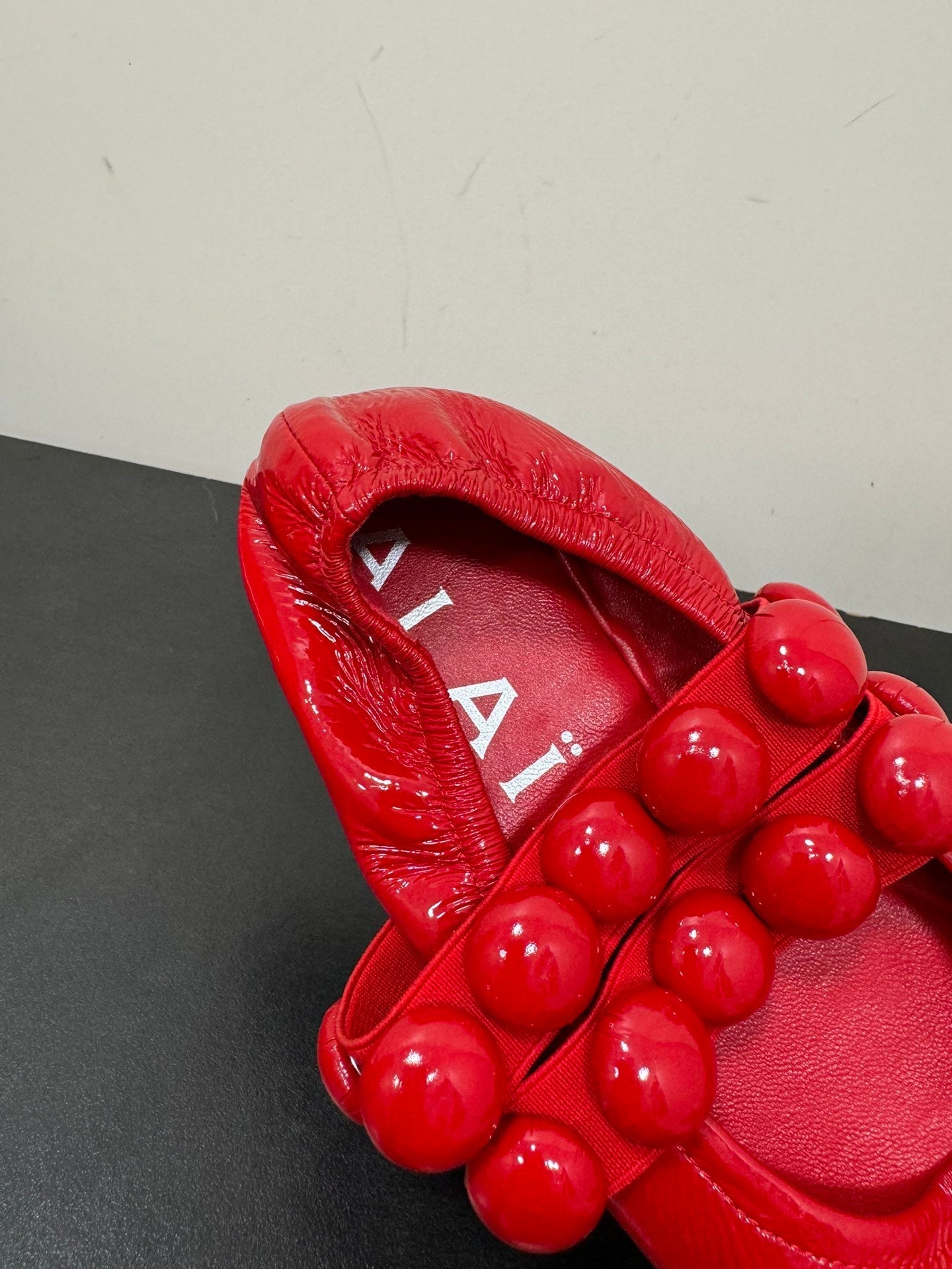 ALAIA SPHERE BALLET FLATS IN CHERRY RED LAMBSKIN