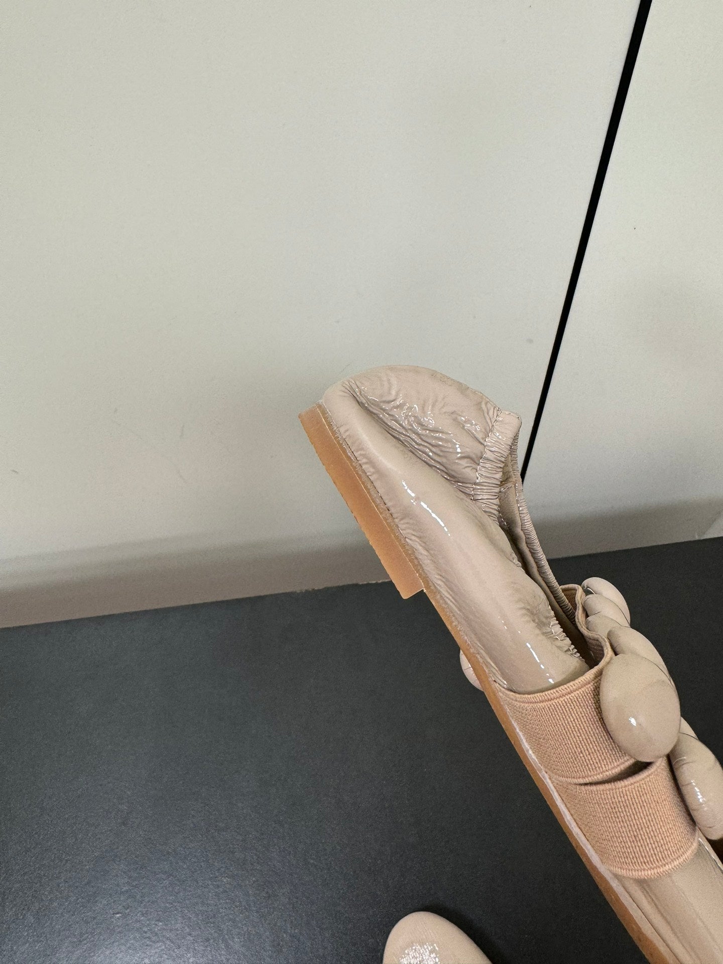 ALAIA SPHERE BALLET FLATS IN ALMOND BEIGE LAMBSKIN