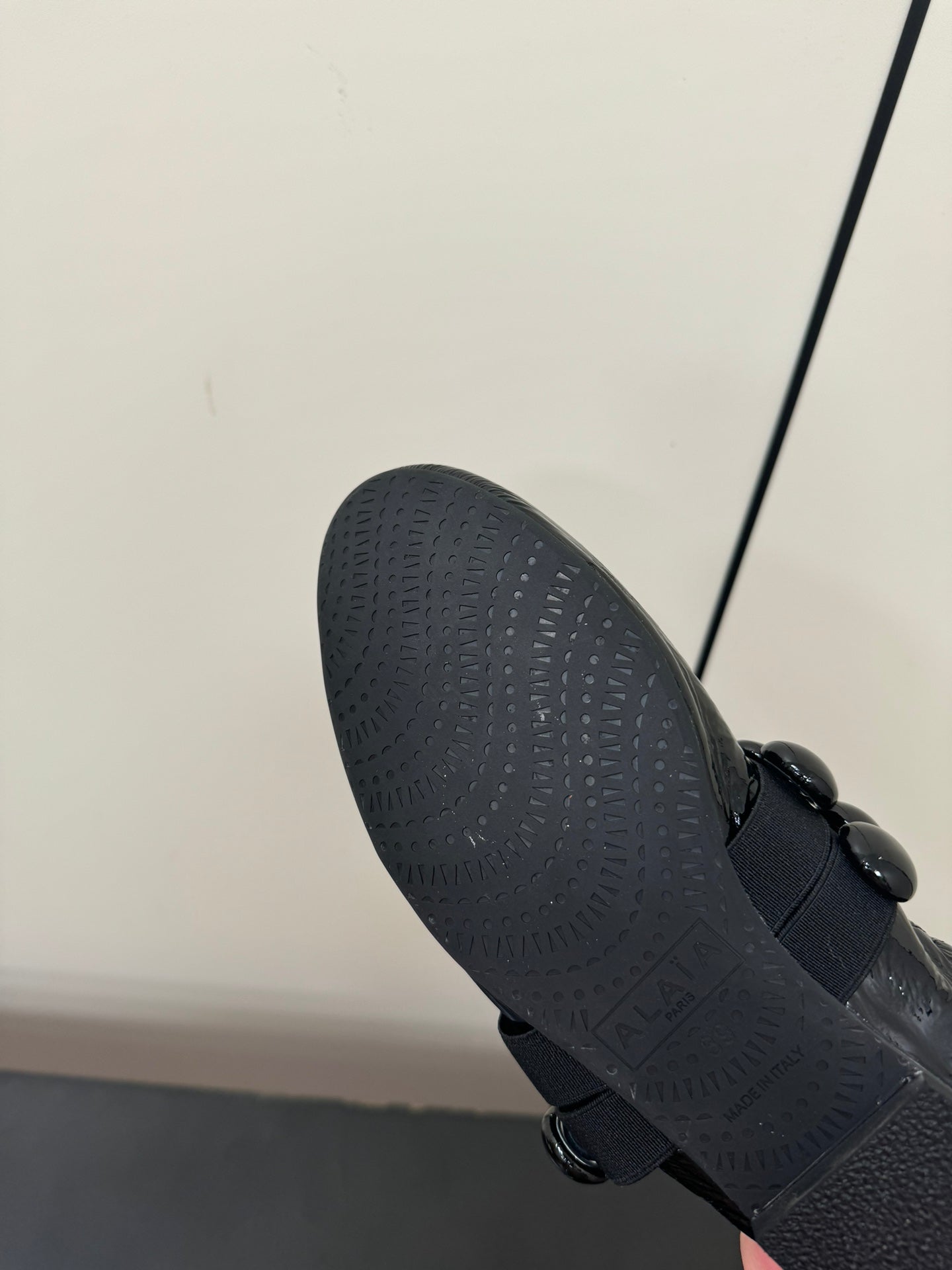 ALAIA SPHERE BALLET FLATS IN BLACK LAMBSKIN