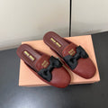 BOW MULES IN RED BROWN SHEEPSKIN