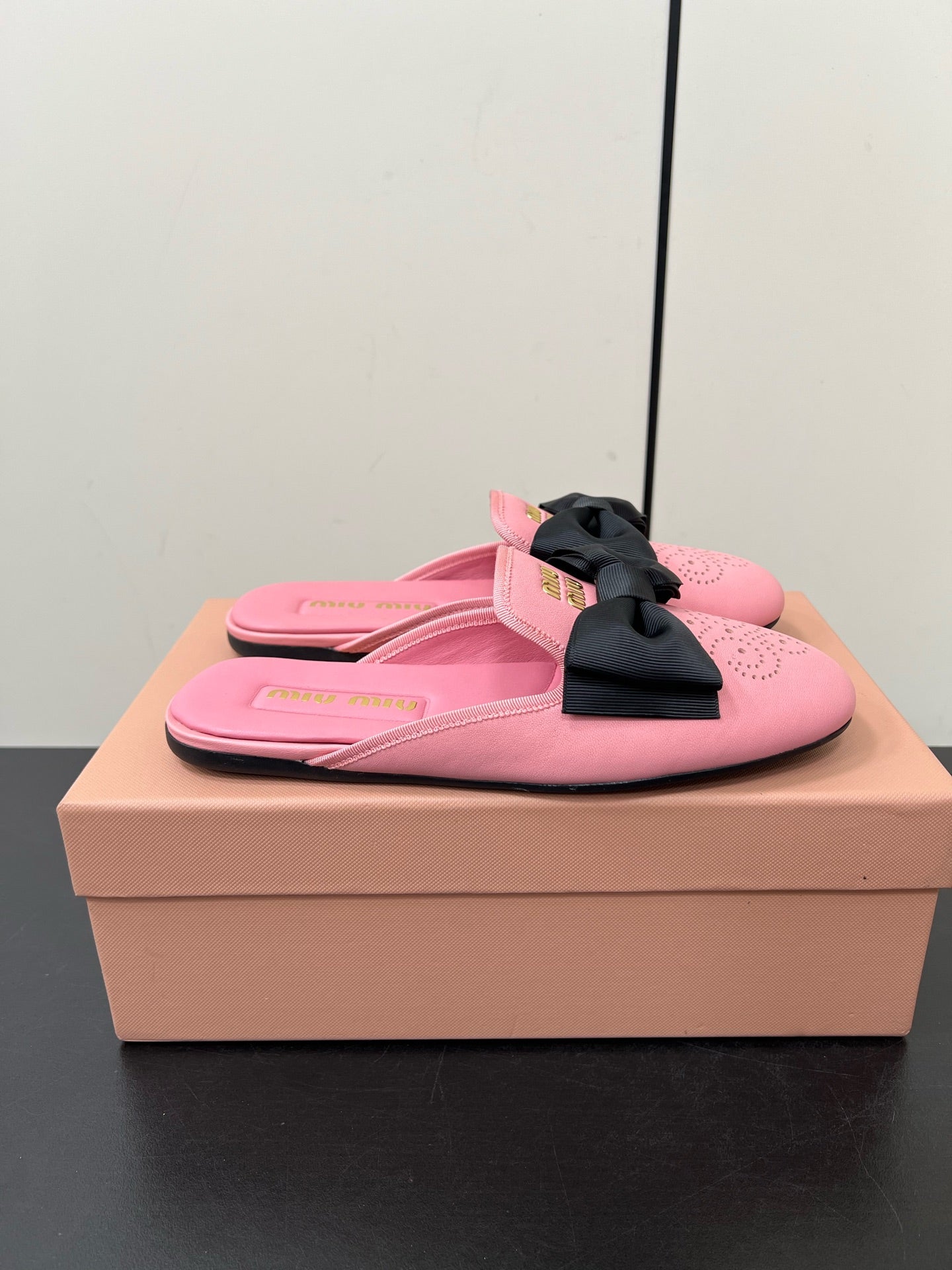 BOW MULES IN PINK SHEEPSKIN