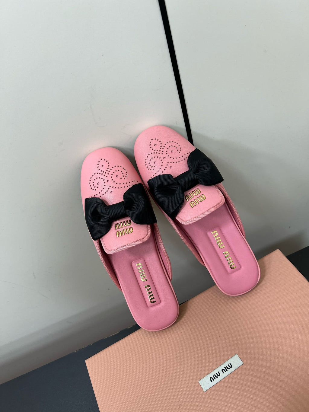 BOW MULES IN PINK SHEEPSKIN