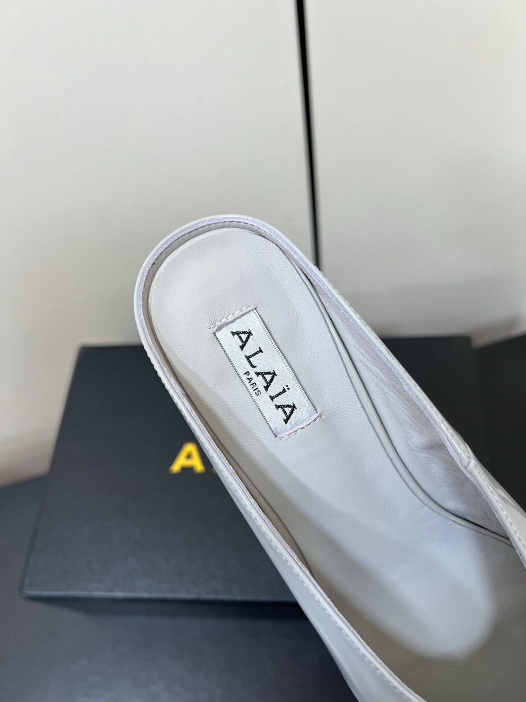 ALAIA WEDGE MULES 25S IN WHITE LAMBSKIN