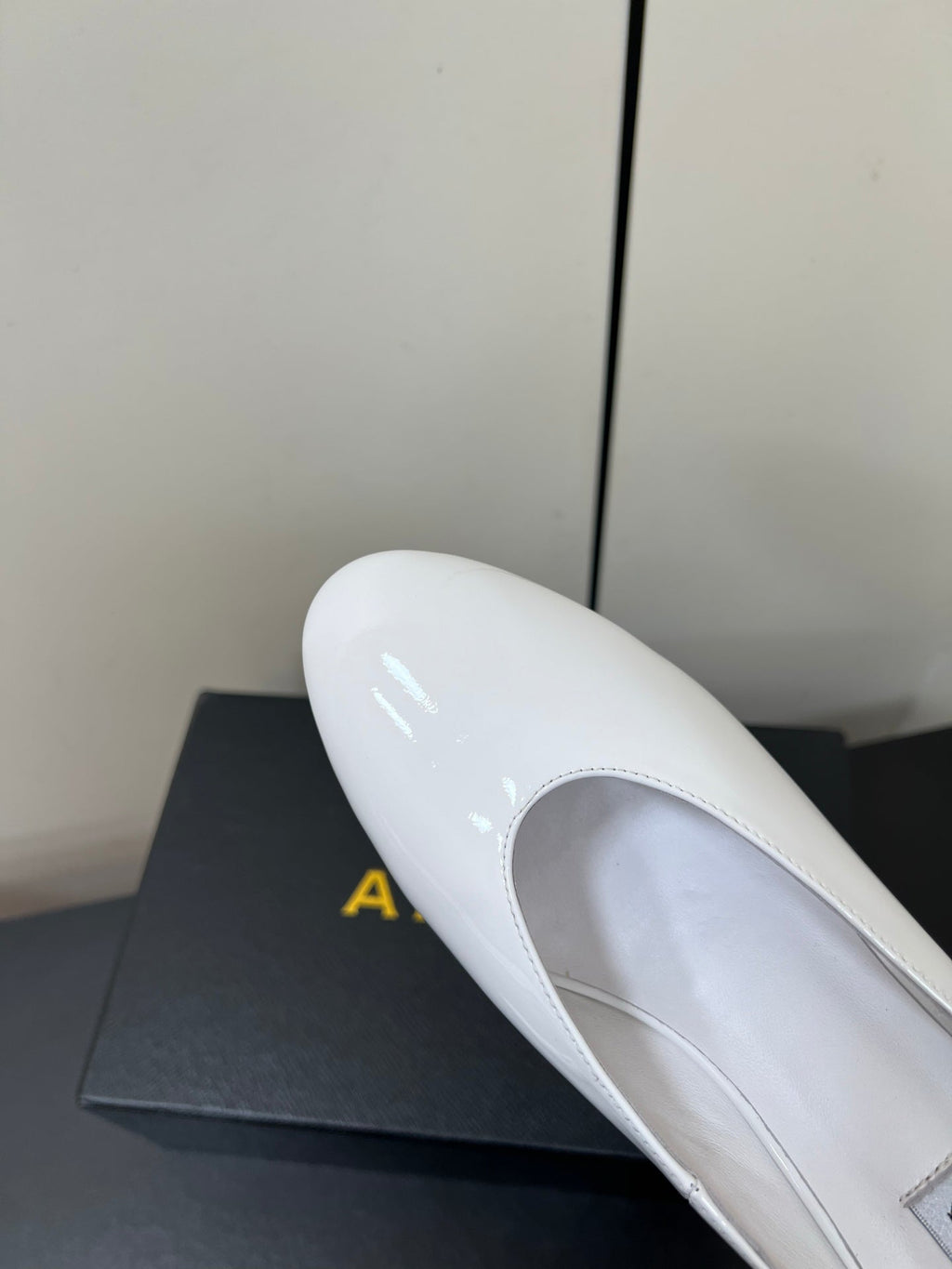 ALAIA WEDGE MULES 25S IN CREAM WHITE LAMBSKIN