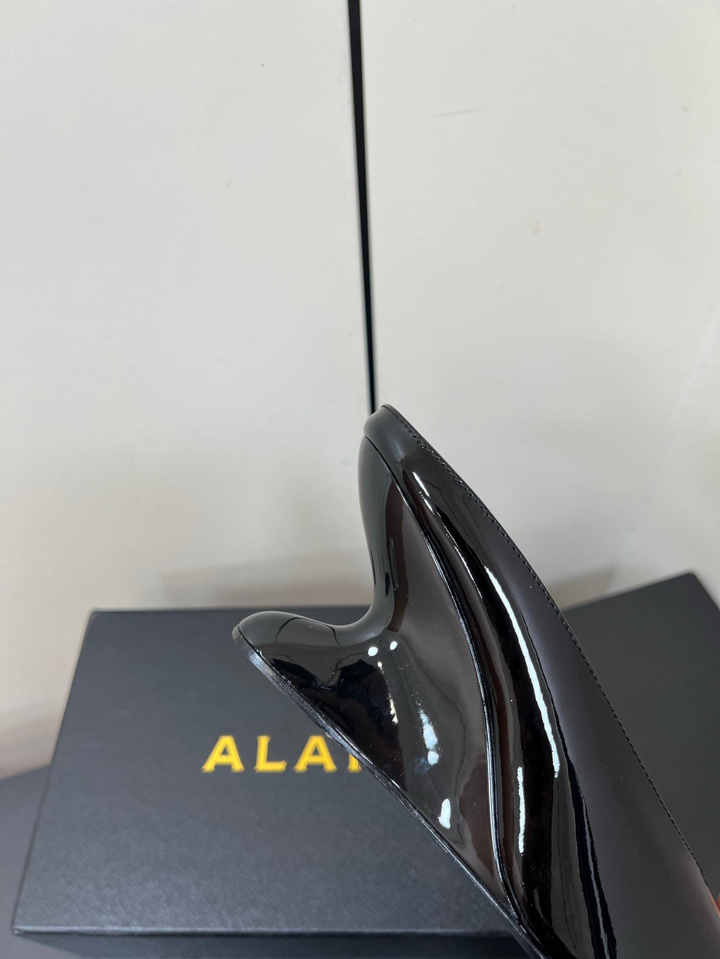 ALAIA WEDGE MULES 25S IN BLACK LAMBSKIN