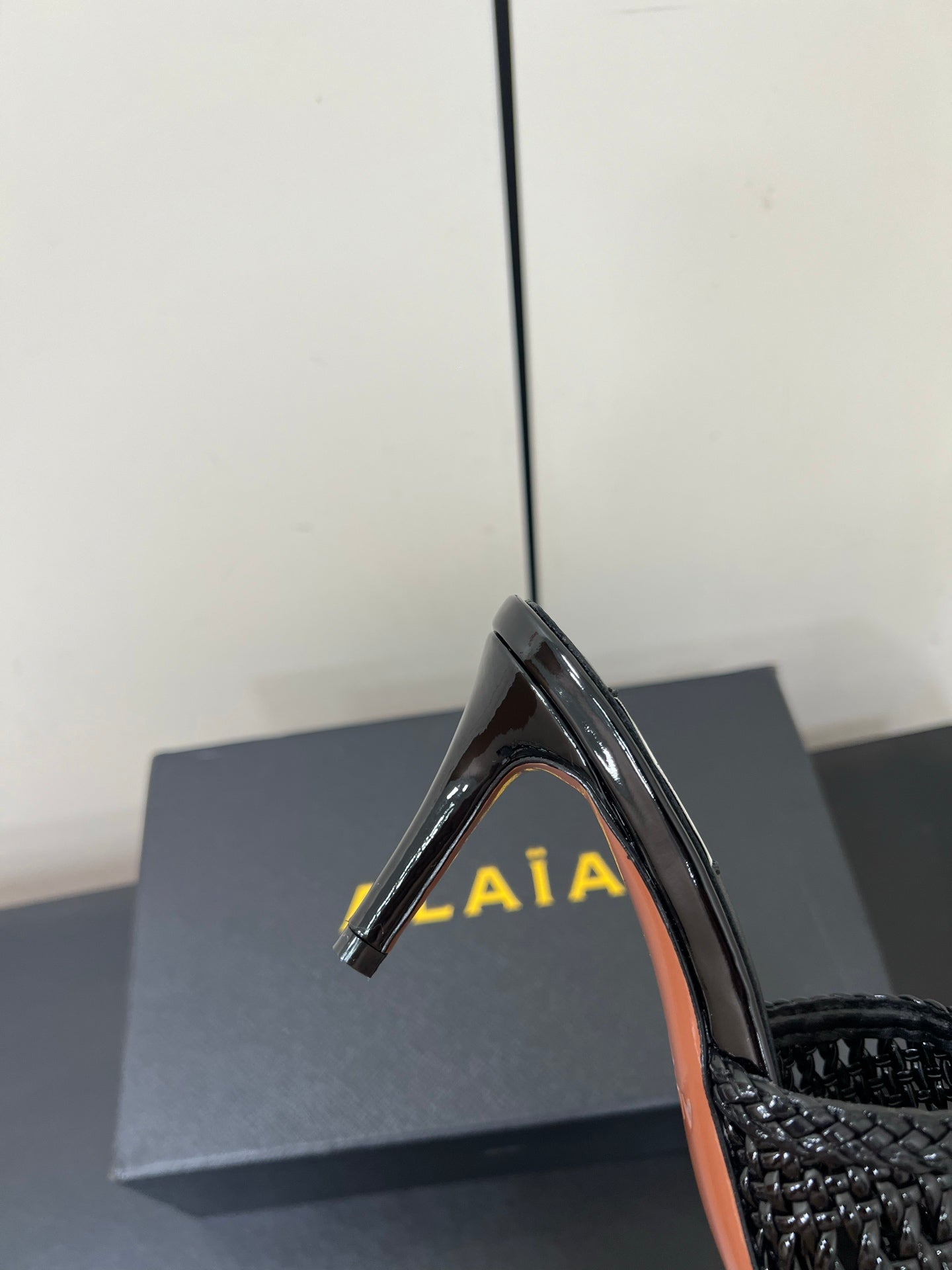 ALAIA HIGH HEEL 25S 70 MM IN BLACK LAMBSKIN WITH WOVEN PATTERN