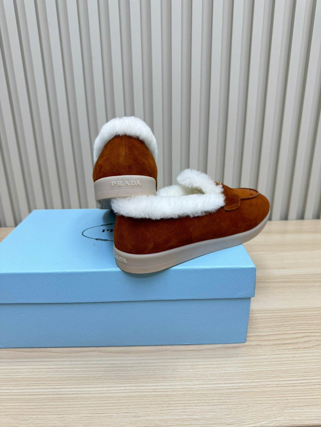 LOAFER IN RED BROWN SUEDE AND FUR LINING ATTACHED TRIANGLE LOGO