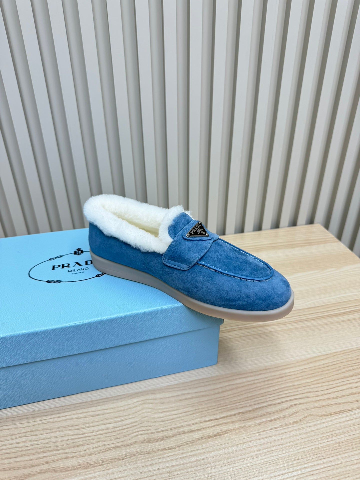 LOAFER IN AZURE BLUE SUEDE AND FUR LINING ATTACHED TRIANGLE LOGO