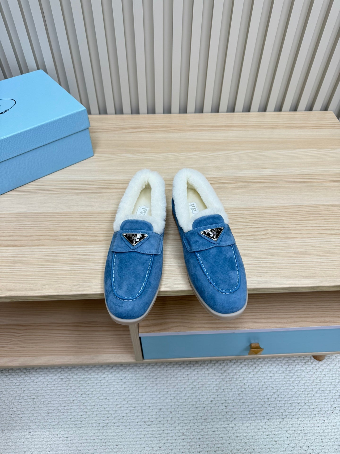 LOAFER IN AZURE BLUE SUEDE AND FUR LINING ATTACHED TRIANGLE LOGO