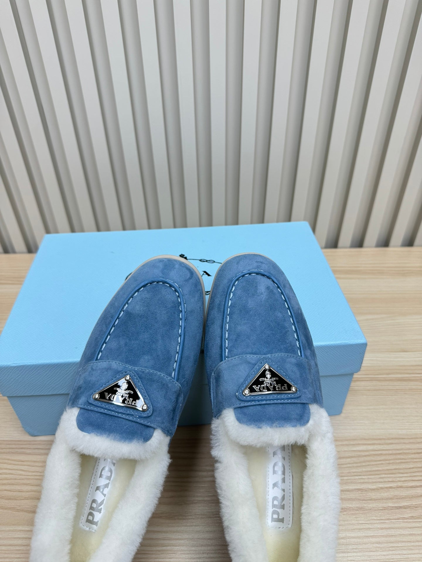 LOAFER IN AZURE BLUE SUEDE AND FUR LINING ATTACHED TRIANGLE LOGO