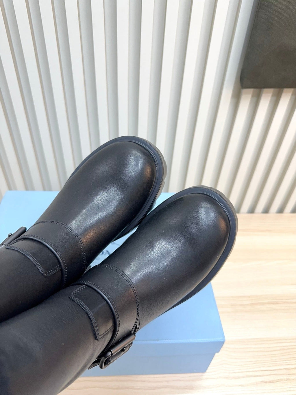 PRADA 25S MARTIN BOOTS IN BLACK CALFSKIN FUR-LINED