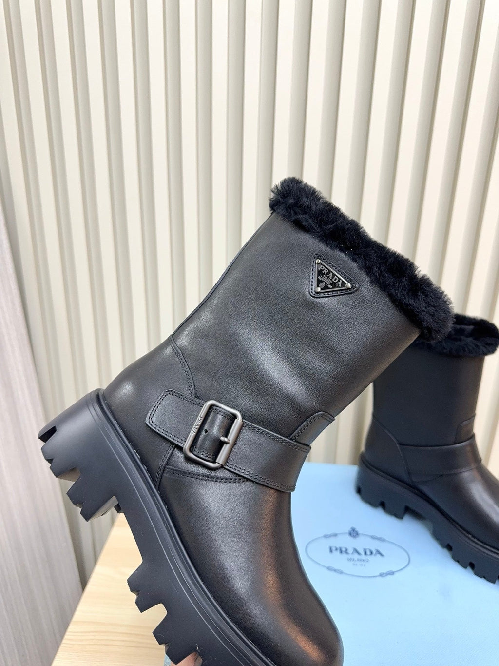 PRADA 25S MARTIN BOOTS IN BLACK CALFSKIN FUR-LINED