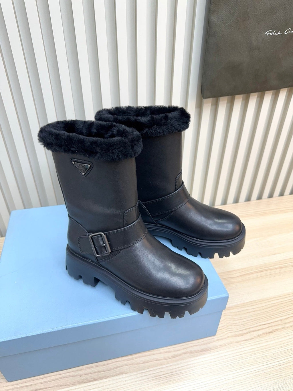 PRADA 25S MARTIN BOOTS IN BLACK CALFSKIN FUR-LINED
