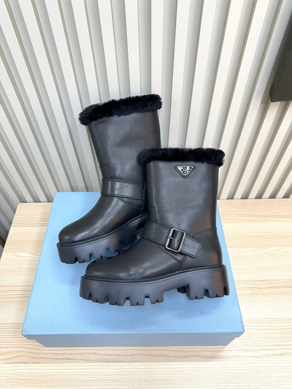 PRADA 25S MARTIN BOOTS IN BLACK CALFSKIN FUR-LINED