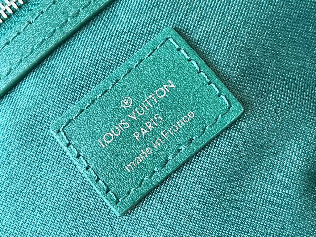 KEEPALL BANDOULIÈRE 50 IN GREEN MONOGRAM HERITAGE CANVAS