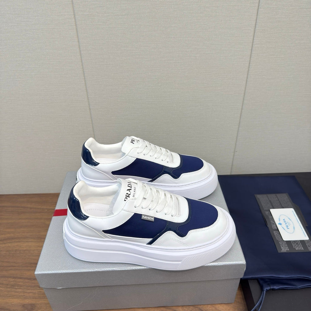 PRADA 25S DOWNTOWN BOLD SNEAKERS 45MM IN WHITE AND NAVY BLUE CALFSKIN
