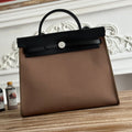 ZIP CABINE 31 BAG IN CHOCOLATE BROWN CANVAS AND BLACK CALFSKIN