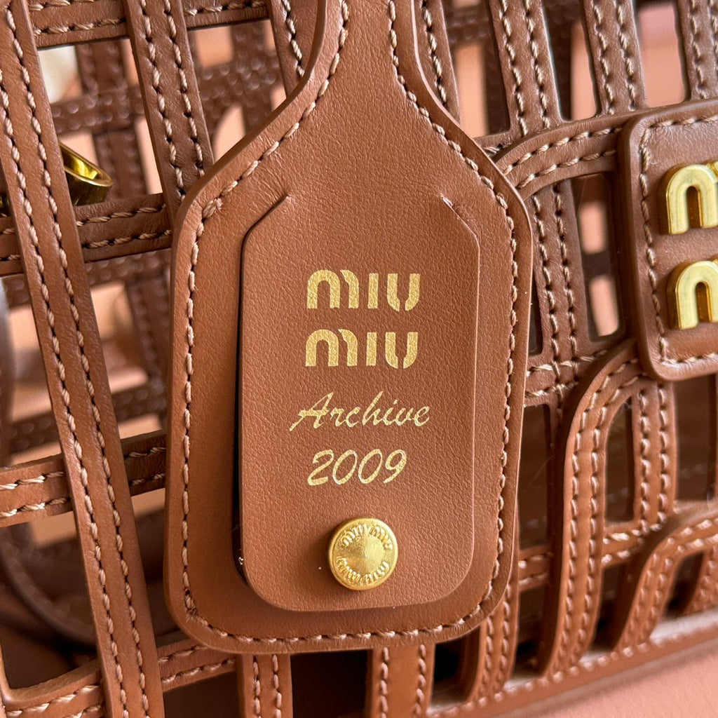 WOVEN HOLLOW BAG 24 IN DARK BROWN CALFSKIN