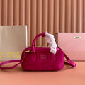 ARCADIE BAG 22 IN FUCHSIA SUEDE GOLD HARDWARE