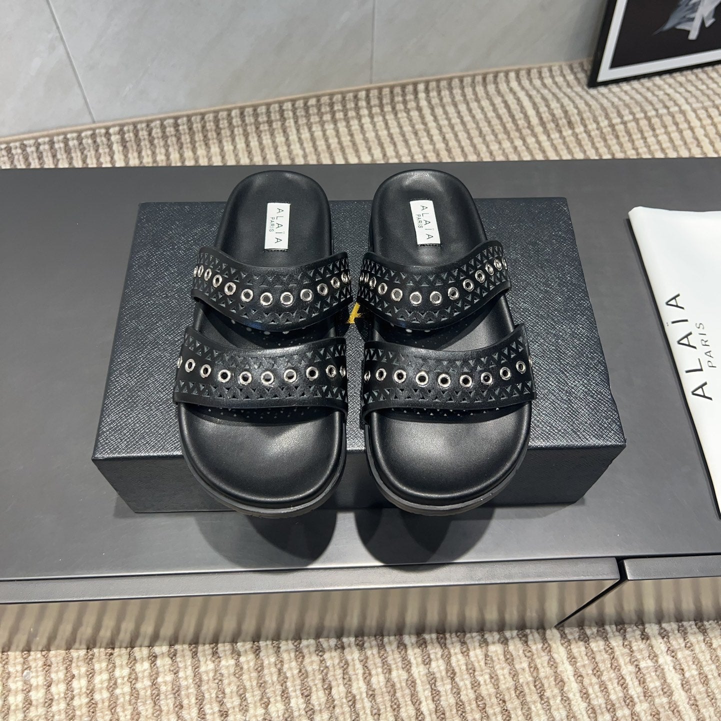 ALAIA DOUBLE-STRAP SANDALS 25S IN BLACK CALFSKIN