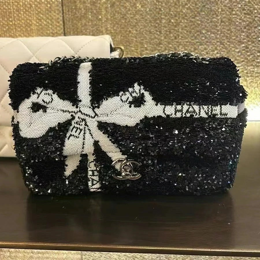 CHANEL 25S FLAP BAG 20 CM IN BLACK SEQUINS WITH WHITE BOW