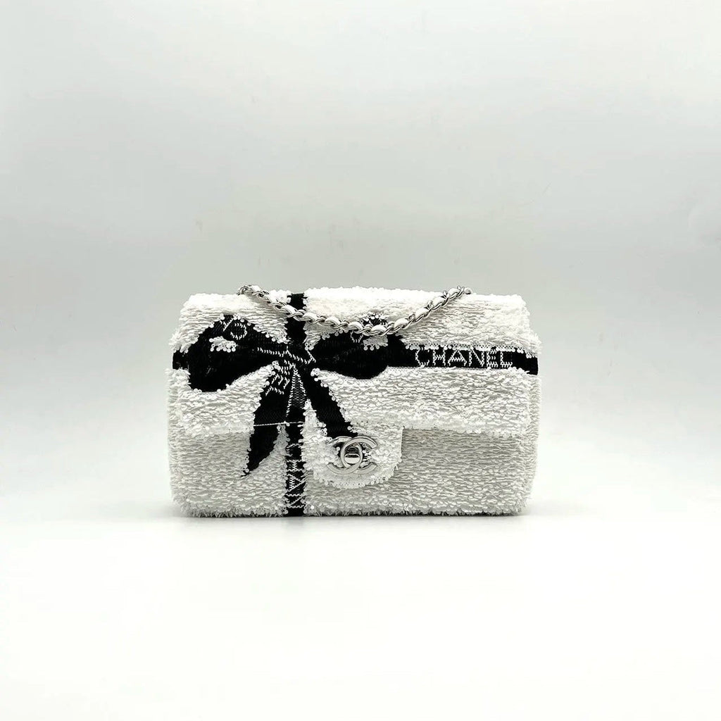 CHANEL 25S FLAP BAG 20 CM IN WHITE SEQUINS WITH BLACK BOW