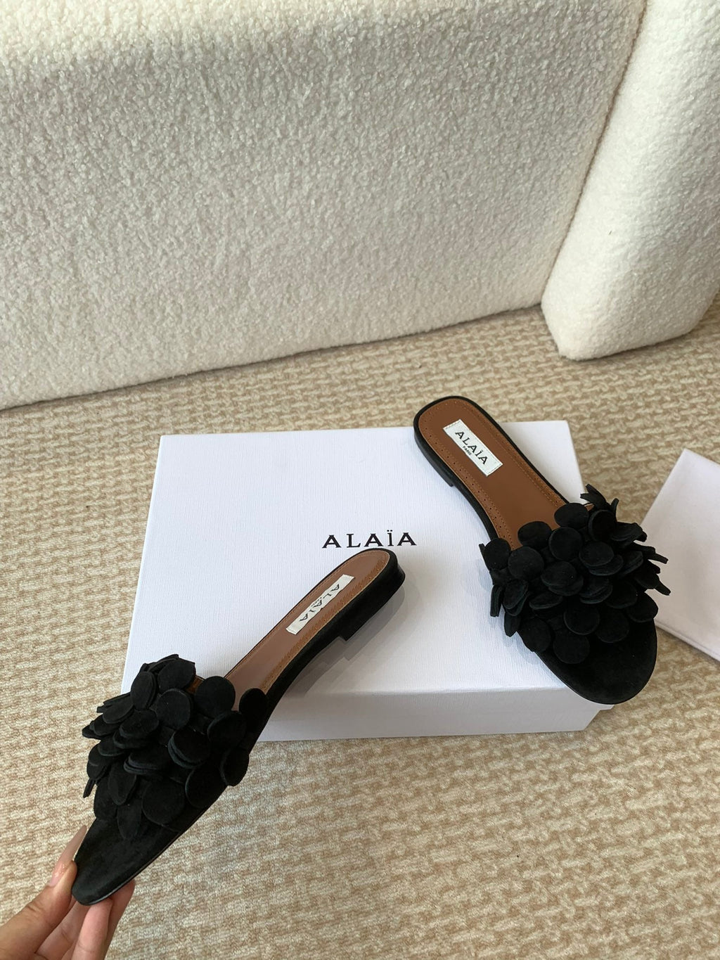 ALAIA FLAT MULE IN BLACK SUEDE