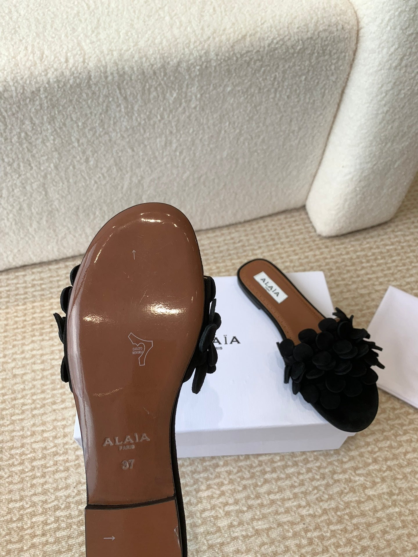 ALAIA FLAT MULE IN BLACK SUEDE