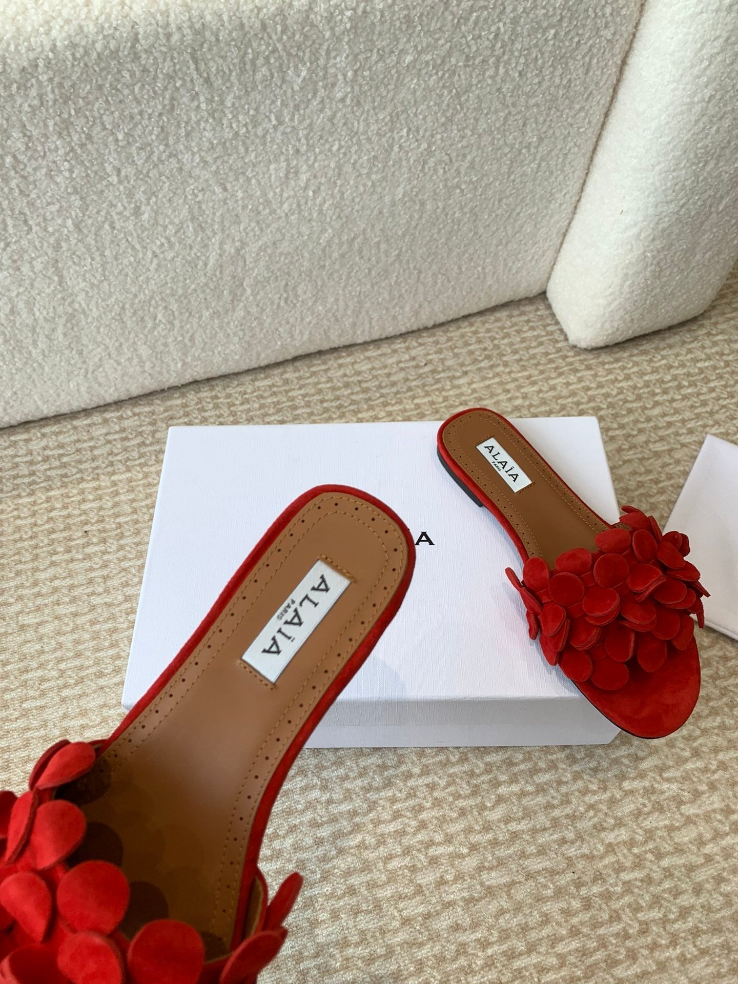 ALAIA FLAT MULE IN CHERRY RED SUEDE