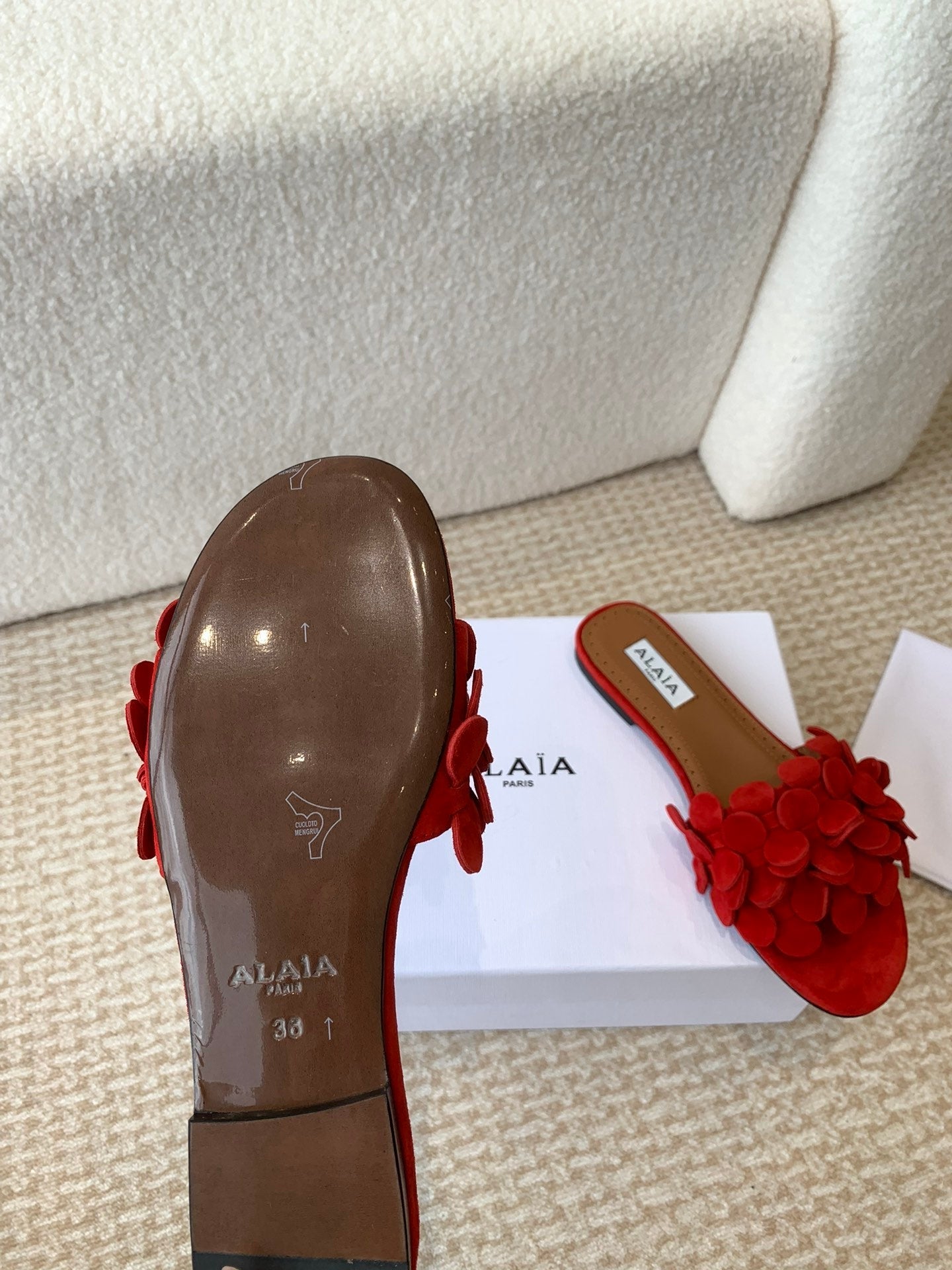 ALAIA FLAT MULE IN CHERRY RED SUEDE