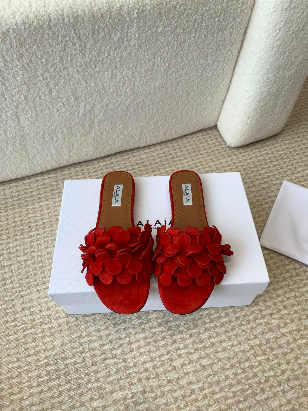 ALAIA FLAT MULE IN CHERRY RED SUEDE