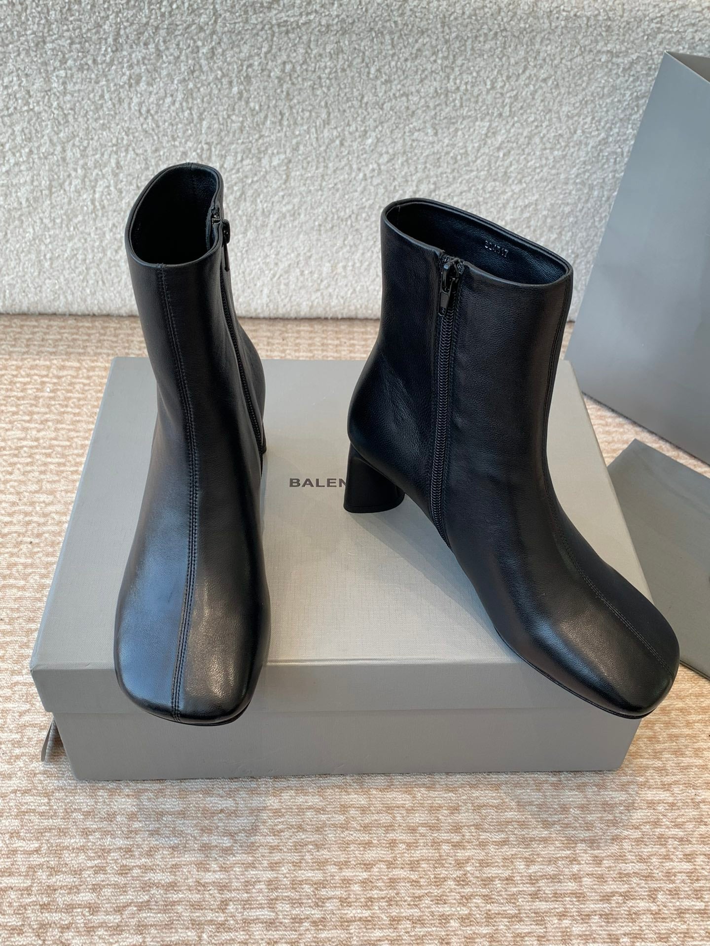 ANKLE BOOTS IN BLACK LOGO EMBOSSED SOFT SHEEPSKIN