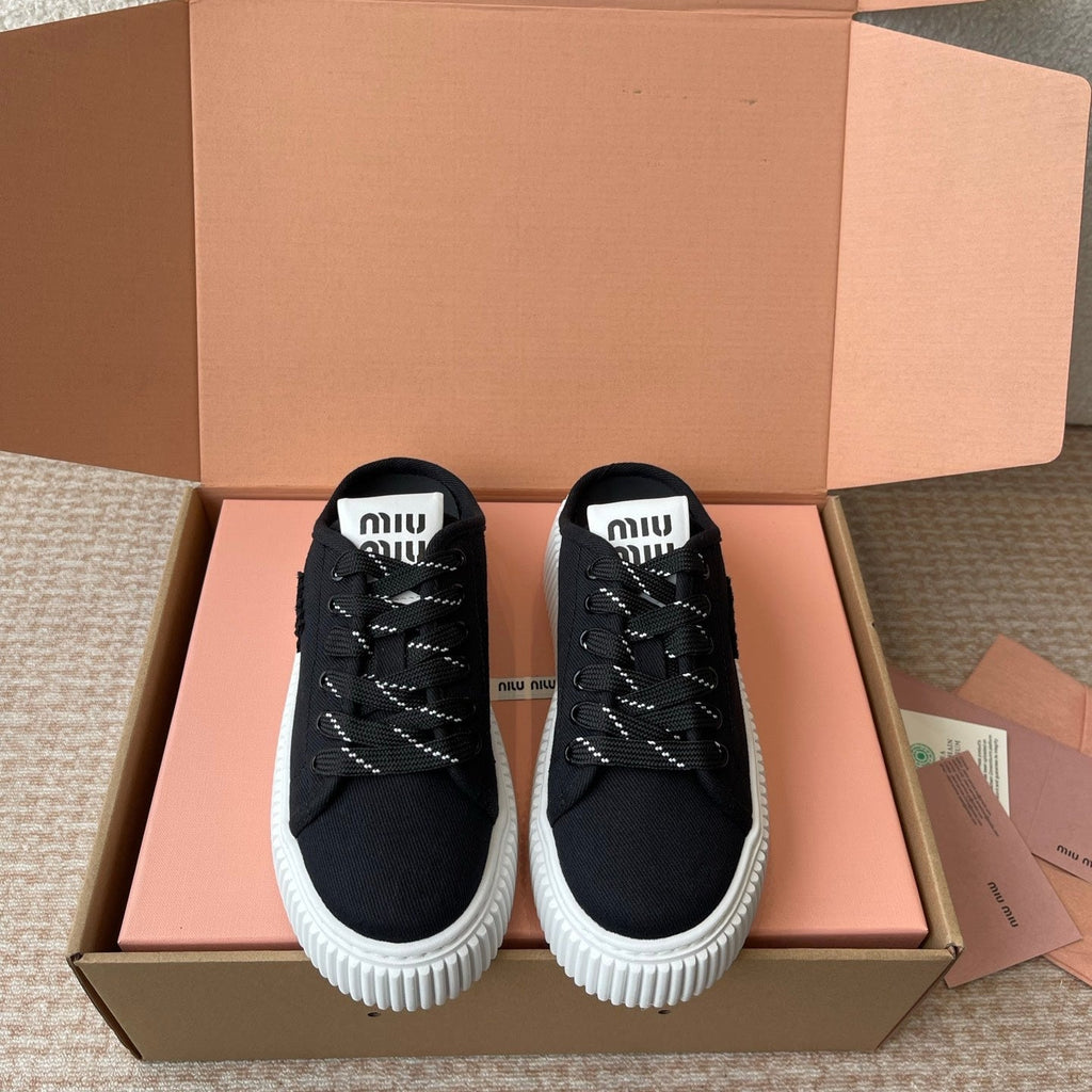 WASH SNEAKER MULES IN BLACK DENIM