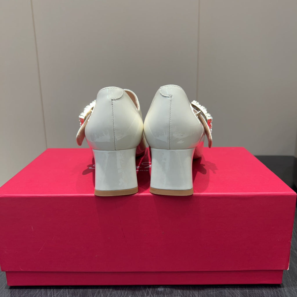ROGER VIVIER 25S TRÈS VIVIER 50MM IN IVORY CALFSKIN WITH RHINESTONE BUCKLE