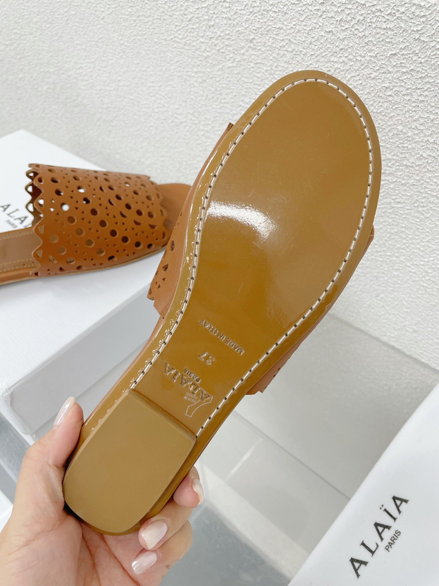 ALAIA VIENNE FLAT MULES IN CHOCOLATE BROWN LAMBSKIN