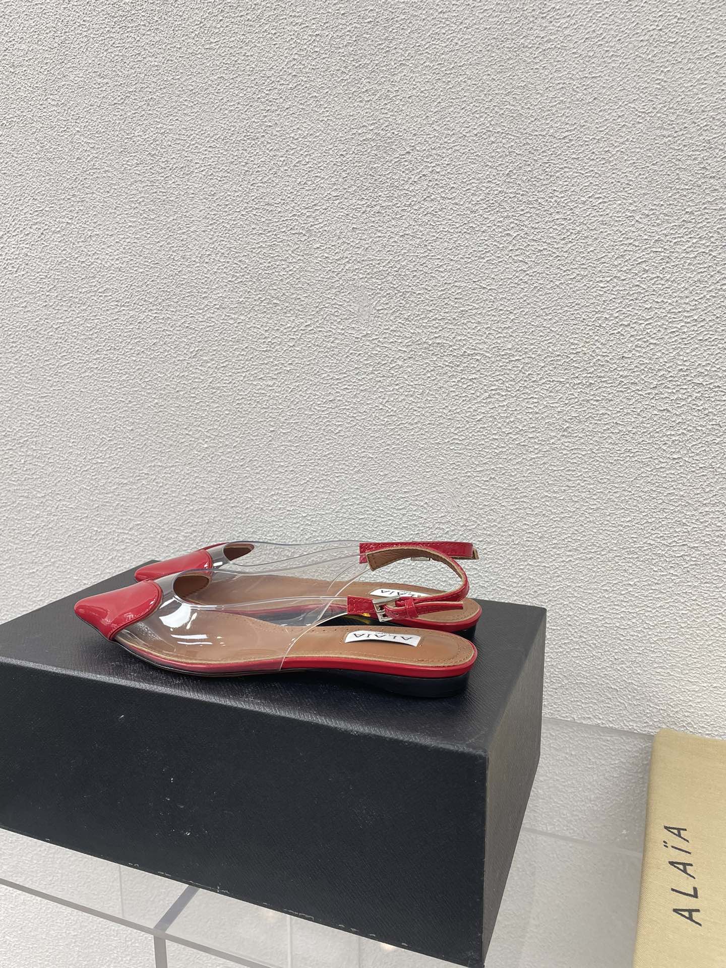 ALAIA LE COEUR FLAT SLINGBACKS IN CHERRY RED PATENT LAMBSKIN