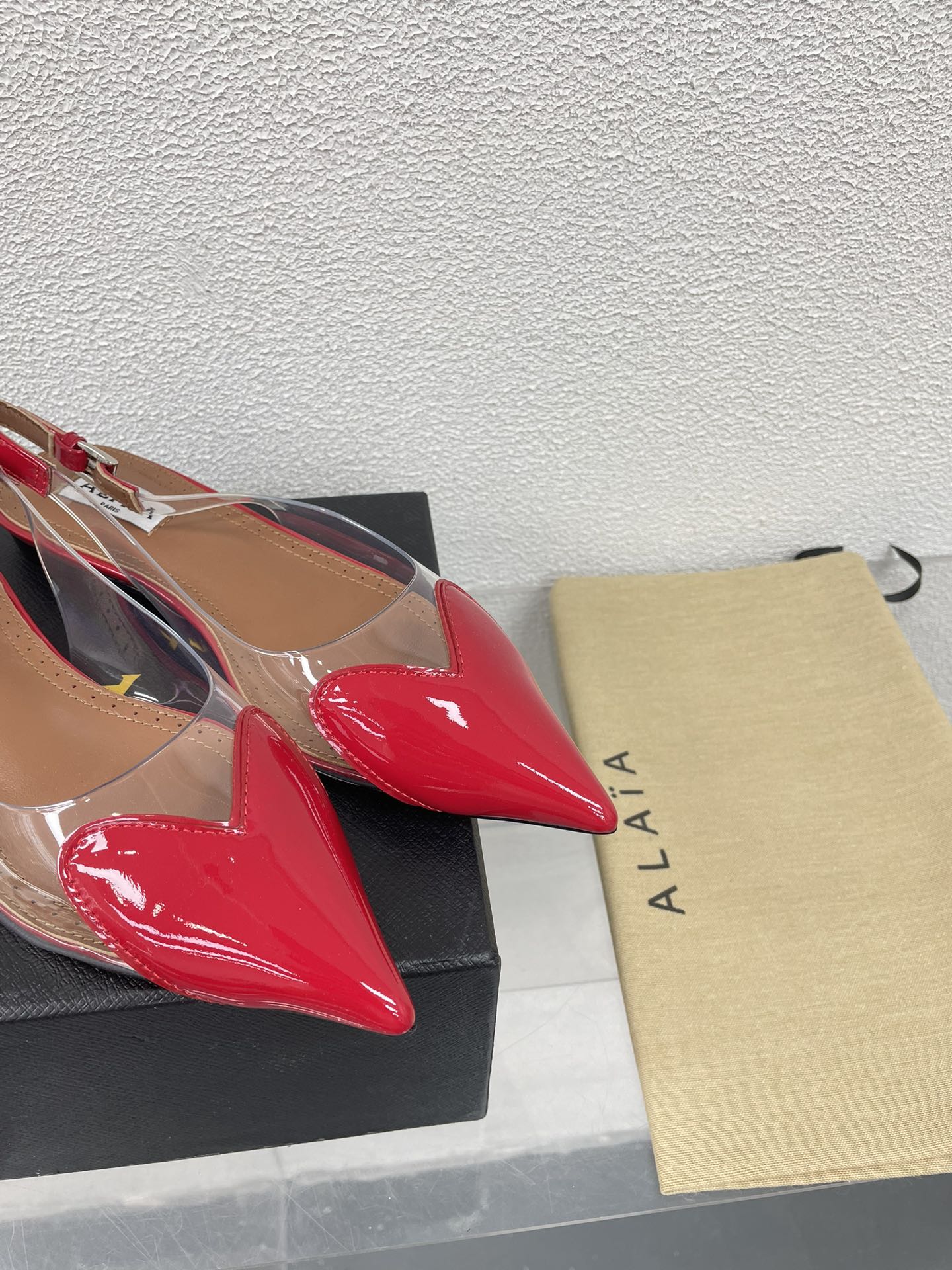 ALAIA LE COEUR FLAT SLINGBACKS IN CHERRY RED PATENT LAMBSKIN
