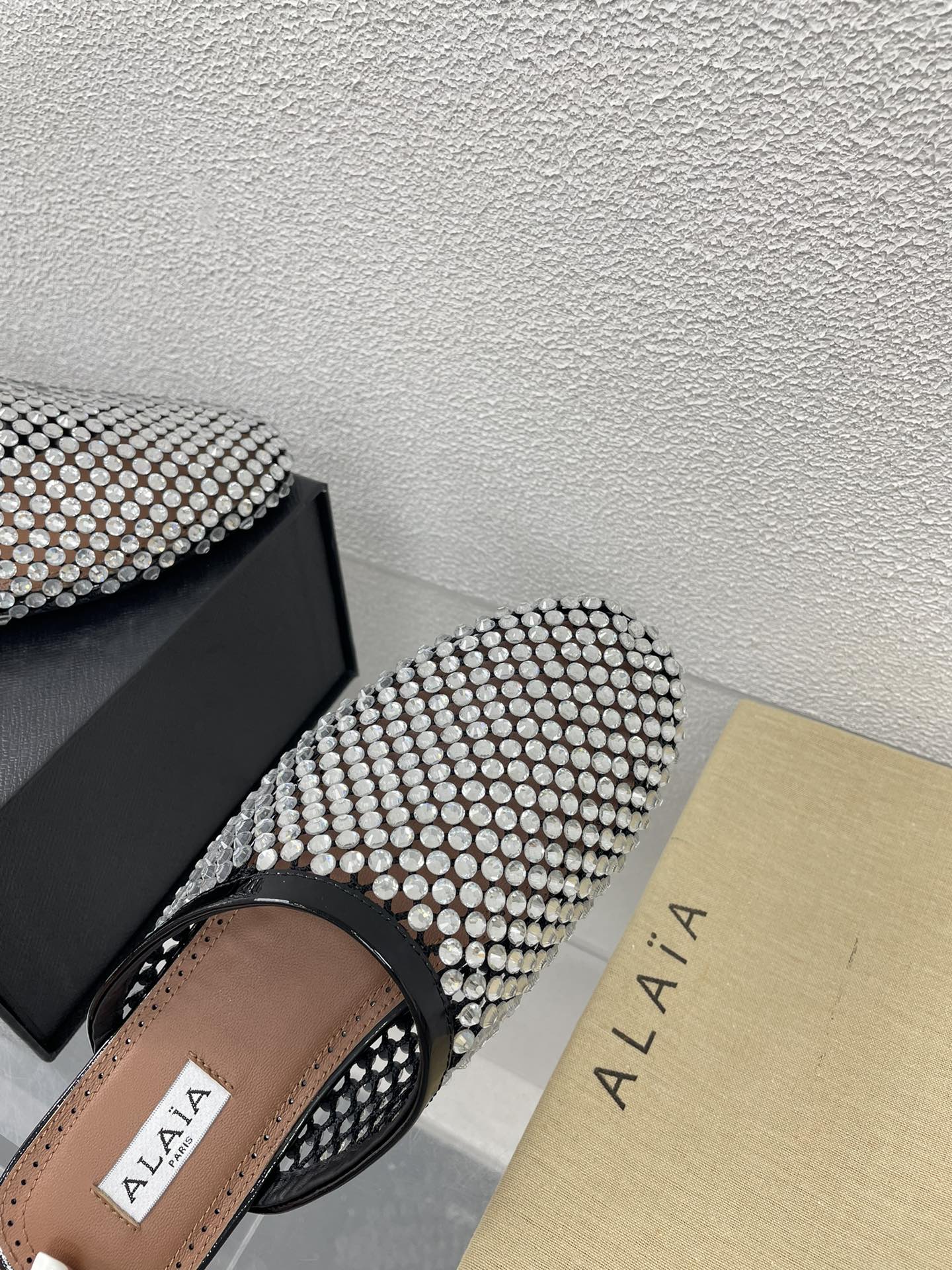 ALAIA FLAT MULES IN STRASS BLACK LAMBSKIN WITH RHINSTONES