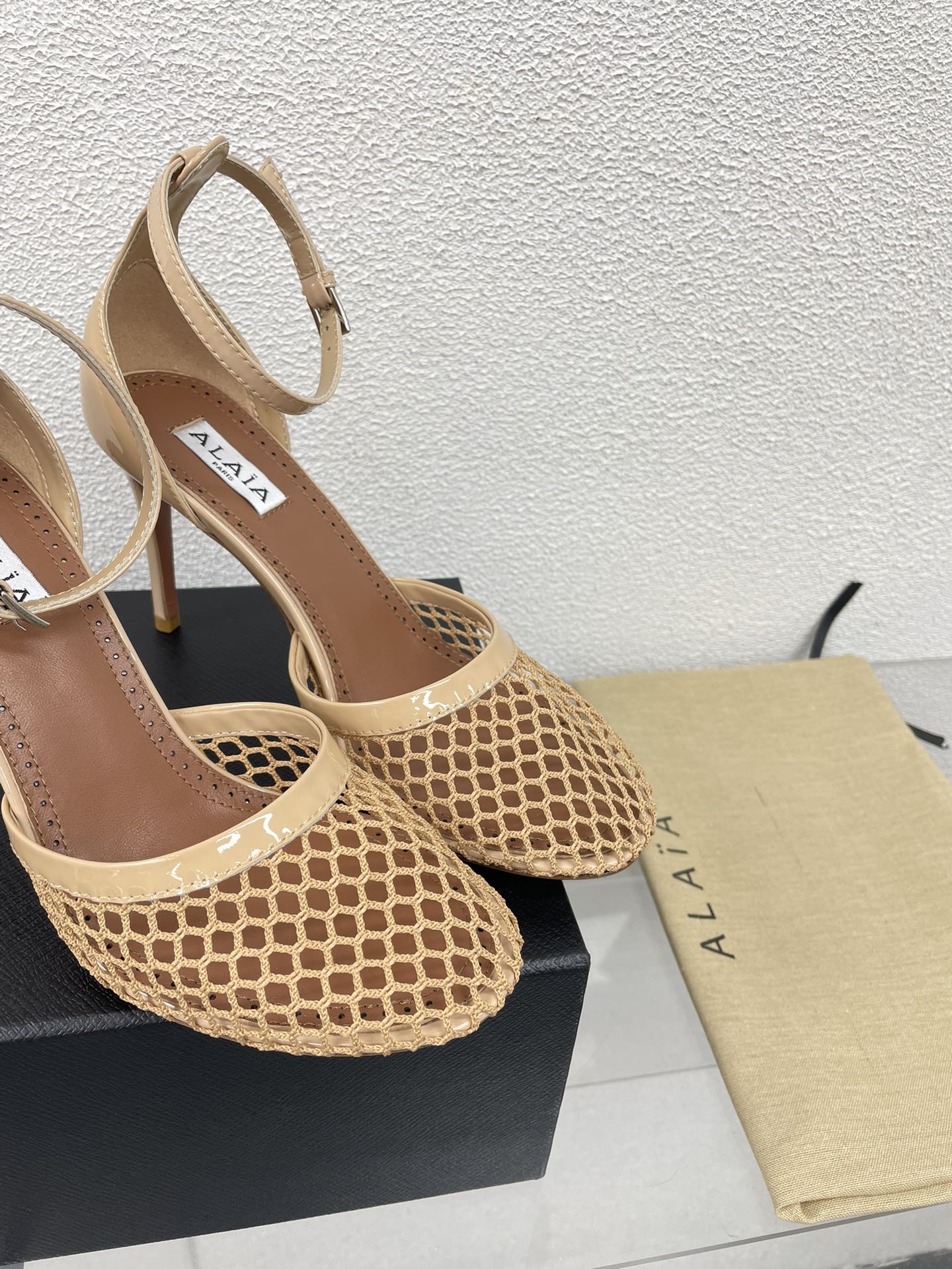 ALAIA HIGH FISHNET 9 CM PUMPS IN EGG NOG MESH