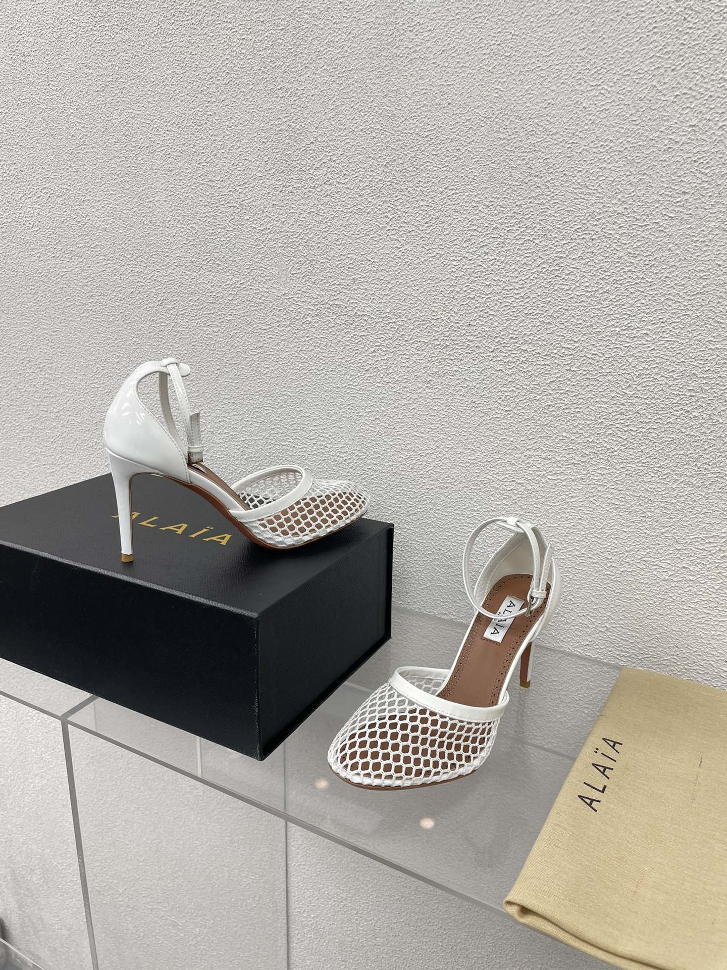 ALAIA HIGH FISHNET 9 CM PUMPS IN WHITE MESH