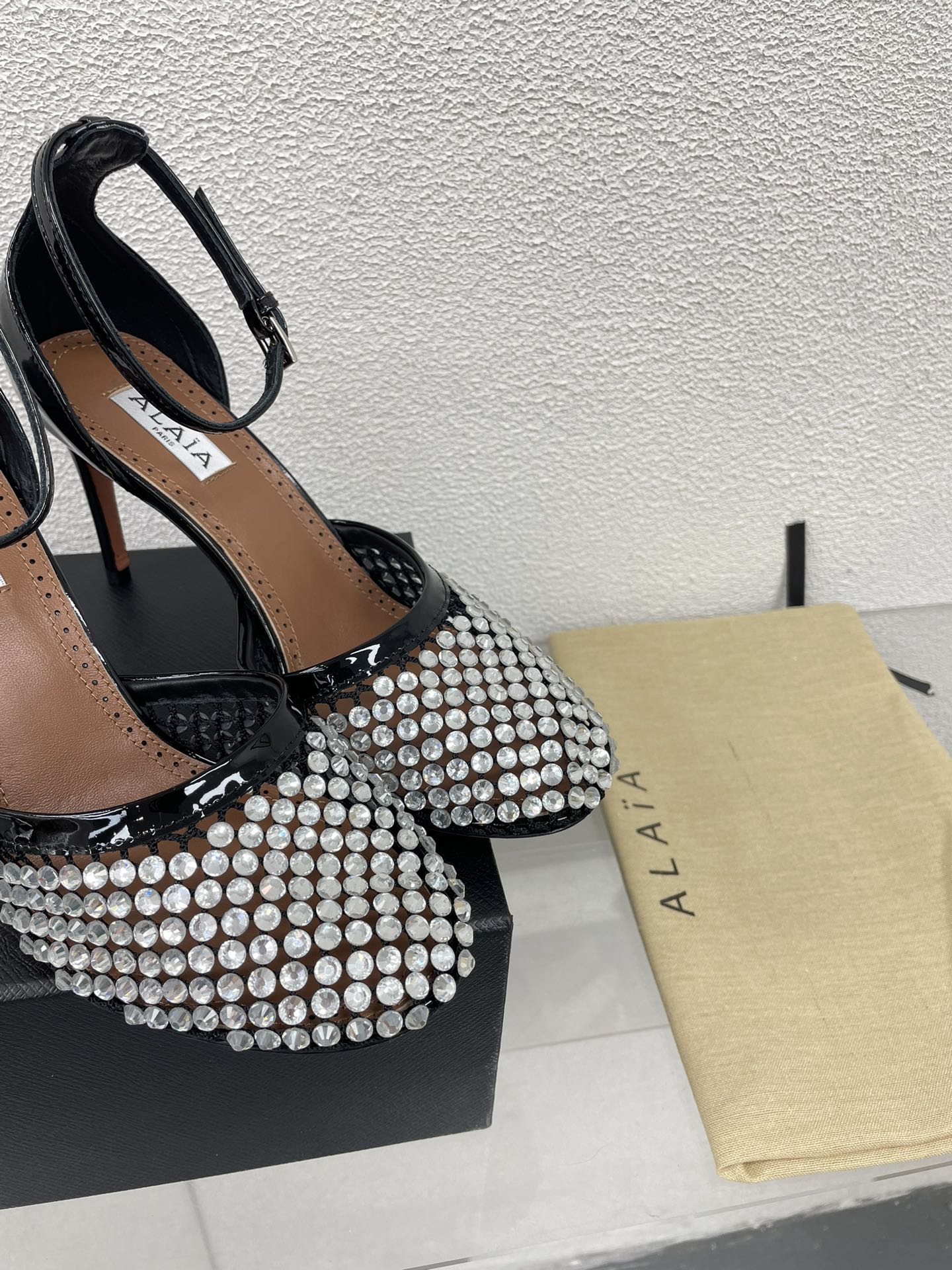 ALAIA HIGH FISHNET PUMPS IN BLACK MESH WITH WHITE RHINSTONES
