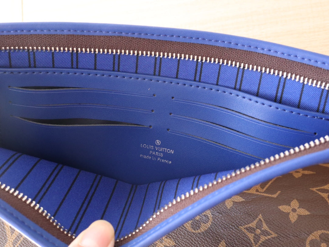 LV 25S POCHETTE VOYAGE 26 IN INDIGO BLUE MONOGRAM MACASSAR COATED CANVAS