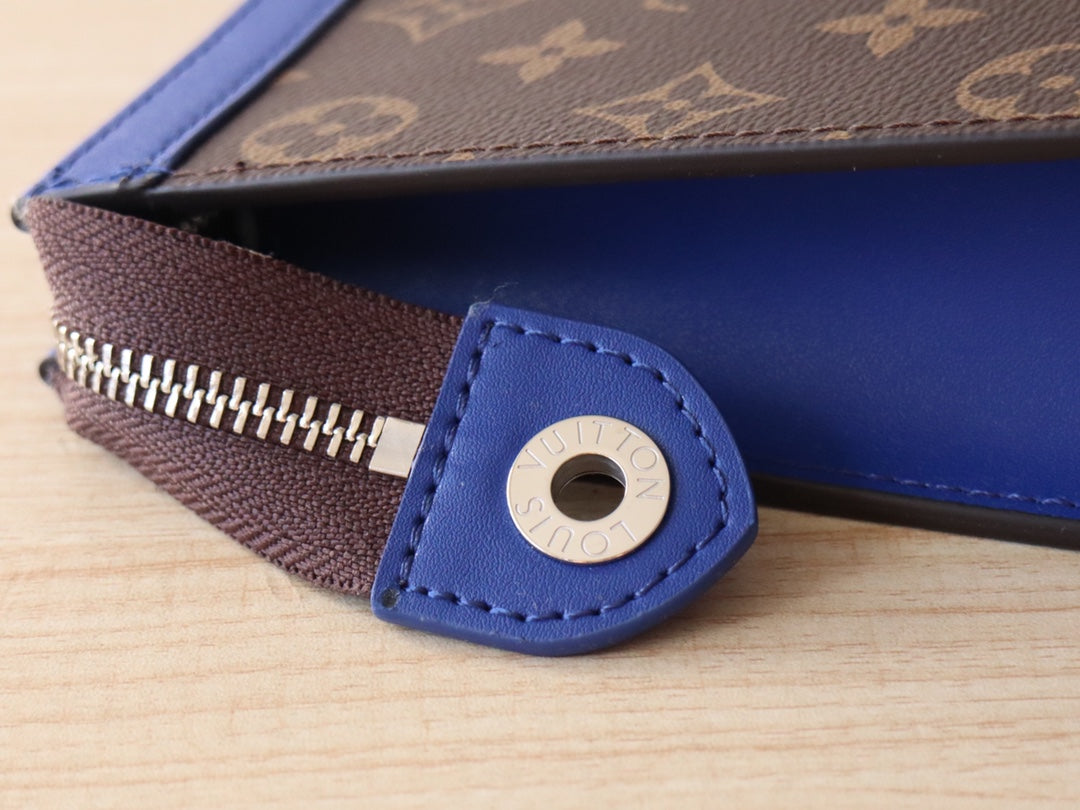 LV 25S POCHETTE VOYAGE 26 IN INDIGO BLUE MONOGRAM MACASSAR COATED CANVAS