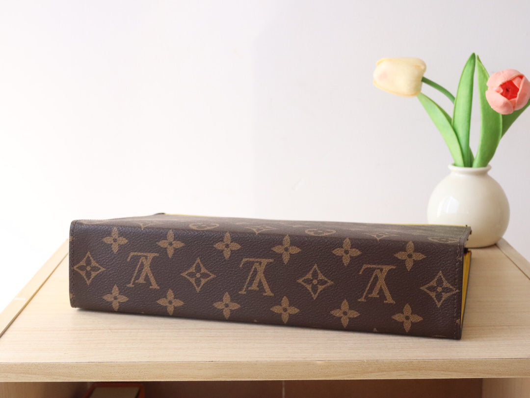LV 25S POCHETTE VOYAGE 26 IN YELLOW MONOGRAM MACASSAR COATED CANVAS