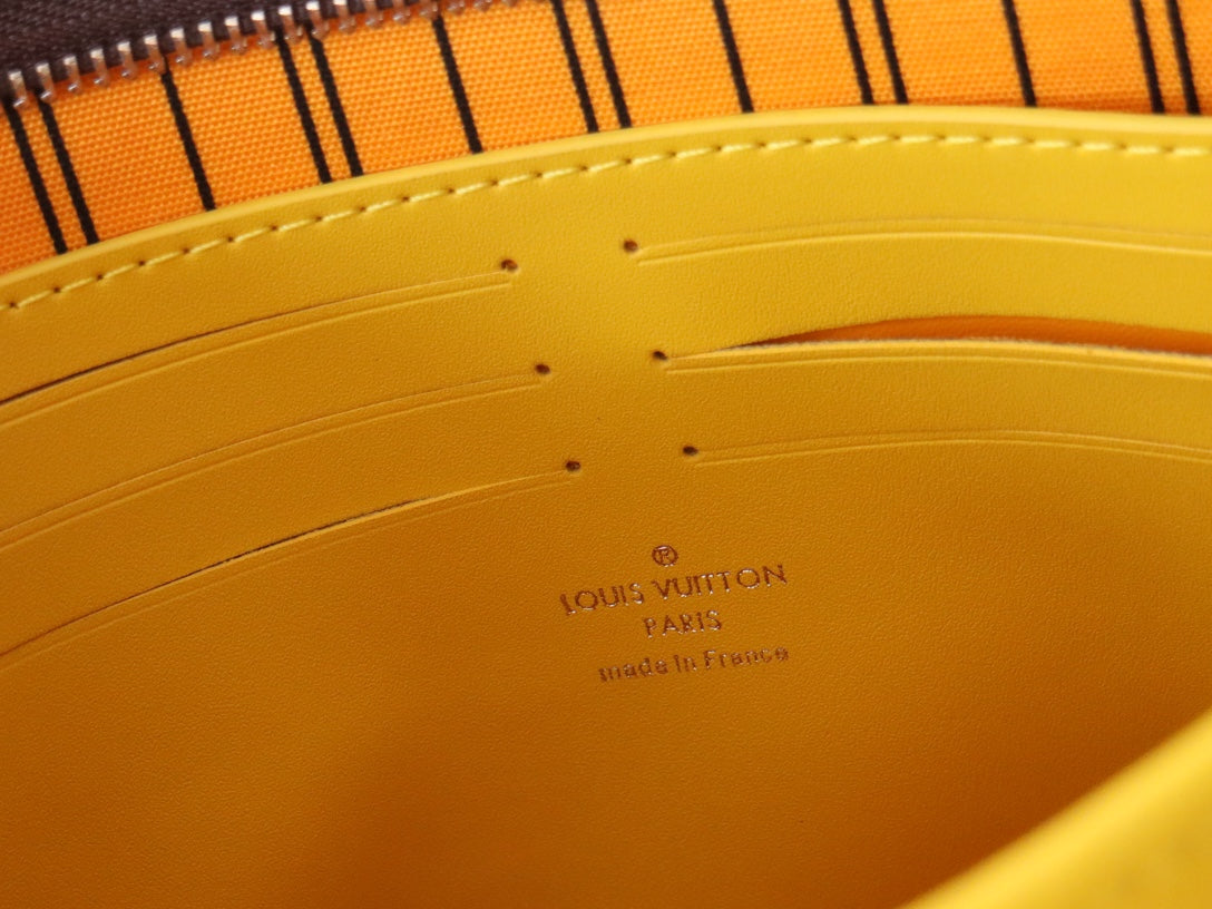 LV 25S POCHETTE VOYAGE 26 IN YELLOW MONOGRAM MACASSAR COATED CANVAS